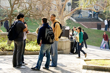 Pre-college students talking on campus between classes