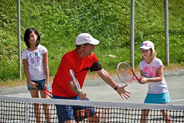 Tennis coaching at summer camp