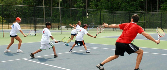 Tennis instruction at summer tennis camps